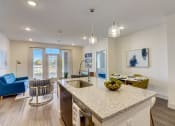 Thumbnail 15 of 44 - an open floor plan with an island kitchen and living room