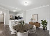 Thumbnail 22 of 70 - A dining room with a wooden table and chairs.