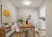 Thumbnail 3 of 19 - a dining room with a wooden table and white chairs