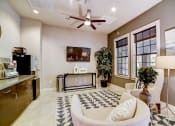 Thumbnail 21 of 42 - a living room with a couch and a tv