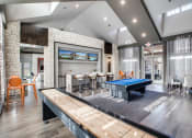 Thumbnail 8 of 28 - a game room with a pool table and a ping pong table