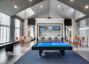 Thumbnail 9 of 28 - a games room with a pool table and a foosball table