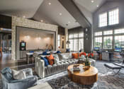 Thumbnail 6 of 28 - a living room filled with furniture and a large window