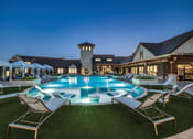 Thumbnail 21 of 28 - a large swimming pool with lounge chairs and umbrellas