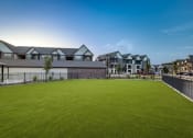 Thumbnail 27 of 28 - a large green lawn in front of a row of houses