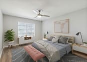 Thumbnail 5 of 19 - a bedroom with a bed and a ceiling fan