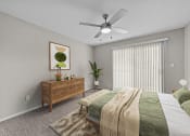 Thumbnail 7 of 29 - an empty bedroom with a bed and a ceiling fan