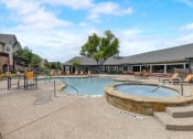 Thumbnail 24 of 48 - our apartments showcase an outdoor pool and hot tub