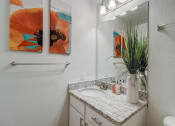Thumbnail 15 of 44 - a bathroom with a sink and a mirror