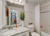 Thumbnail 11 of 44 - the preserve at ballantyne commons apartment bathroom with sink toilet and shower