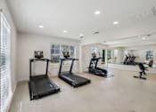 Thumbnail 35 of 47 - A spacious room with treadmills and exercise equipment.