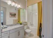 Thumbnail 27 of 52 - a bathroom with a shower toilet and sink and a mirror