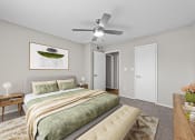 Thumbnail 6 of 29 - a bedroom with a large bed and a ceiling fan