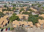 Thumbnail 42 of 45 - A bird's eye view of a residential area with houses and cars.