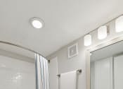 Thumbnail 8 of 19 - a bathroom with a white sink and toilet next to a bathtub with a shower curtain