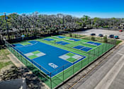 Thumbnail 34 of 42 - an aerial view of a tennis court on a city street