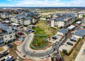 Thumbnail 30 of 33 - an aerial view of a neighborhood with houses and cars