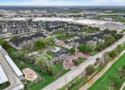 Thumbnail 41 of 42 - an aerial view of a neighborhood of houses in a city