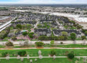 Thumbnail 38 of 42 - an aerial view of a neighborhood with houses and trees