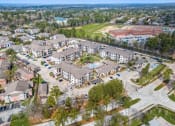 Thumbnail 32 of 35 - an aerial view of a group of apartment buildings and a parking lot