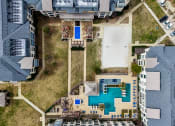 Thumbnail 24 of 33 - arial view of a house with a pool and a yard