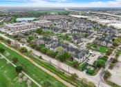 Thumbnail 34 of 42 - an aerial view of a suburb of a city with houses