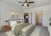 Thumbnail 9 of 50 - a bedroom with a bed and a ceiling fan