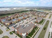 Thumbnail 42 of 44 - an aerial view of an apartment complex and parking lot
