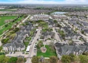 Thumbnail 39 of 42 - an aerial view of a neighborhood with houses and a lake