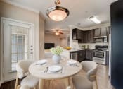 Thumbnail 4 of 42 - a kitchen and dining room with a table and chairs