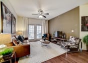 Thumbnail 7 of 42 - a living room with a couch and a chair