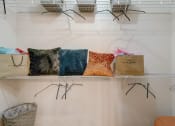 Thumbnail 17 of 44 - a closet filled with bags and pillows on a shelf