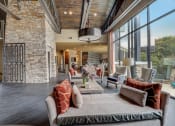 Thumbnail 20 of 50 - a living room with furniture and large windows