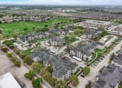 Thumbnail 36 of 42 - an aerial view of a group of houses in a suburb