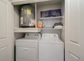 Thumbnail 16 of 44 - the laundry room has a washer and dryer and a shelf above the was