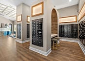 Thumbnail 29 of 29 - A room with wooden floors and black cabinets with light brown trim.