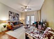 Thumbnail 1 of 42 - a living room with a ceiling fan and hardwood floors