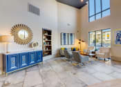 Thumbnail 26 of 44 - a living room with couches and chairs and a table and a mirror