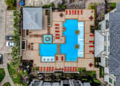 Thumbnail 45 of 52 - arial view of a large swimming pool in a residential yard