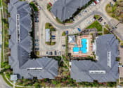 Thumbnail 48 of 52 - a birds eye view of a neighborhood with houses and a parking lot