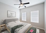 Thumbnail 30 of 70 - A bedroom with a bed, a ceiling fan, and a picture on the wall.