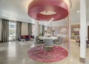 Thumbnail 23 of 37 - a dining area with a table and chairs in a lobby
