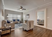 Thumbnail 2 of 48 - a living room with couches and chairs
