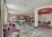 Thumbnail 24 of 37 - a living room with a pink couch and a dining room table and a kitchen