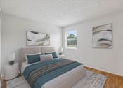Thumbnail 7 of 26 - A bedroom with a large bed and two paintings on the wall.