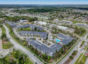 Thumbnail 49 of 52 - an aerial view of a city with many buildings and a pool