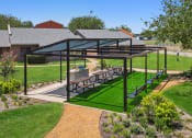 Thumbnail 12 of 19 - a pergola with a picnic table under it