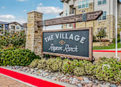 Thumbnail 44 of 44 - A sign that says "The Village Rayzor Ranch" in front of a building.