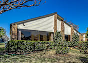 Thumbnail 20 of 42 - the front of a house with a yard in front of it