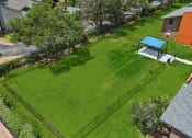 Thumbnail 13 of 19 - an aerial view of a backyard with a tennis court and basketball court